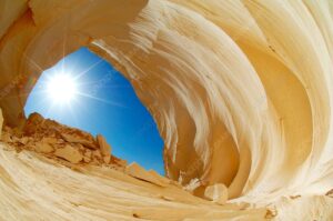 Rock archway, Egypt's White Desert. This structure has been formed by wind erosion of the white chalk that forms the desert sands in this region. Photographed in the White Desert (Sahara el Beyda) in Western Egypt's Libyan Desert, part of the Sahara.